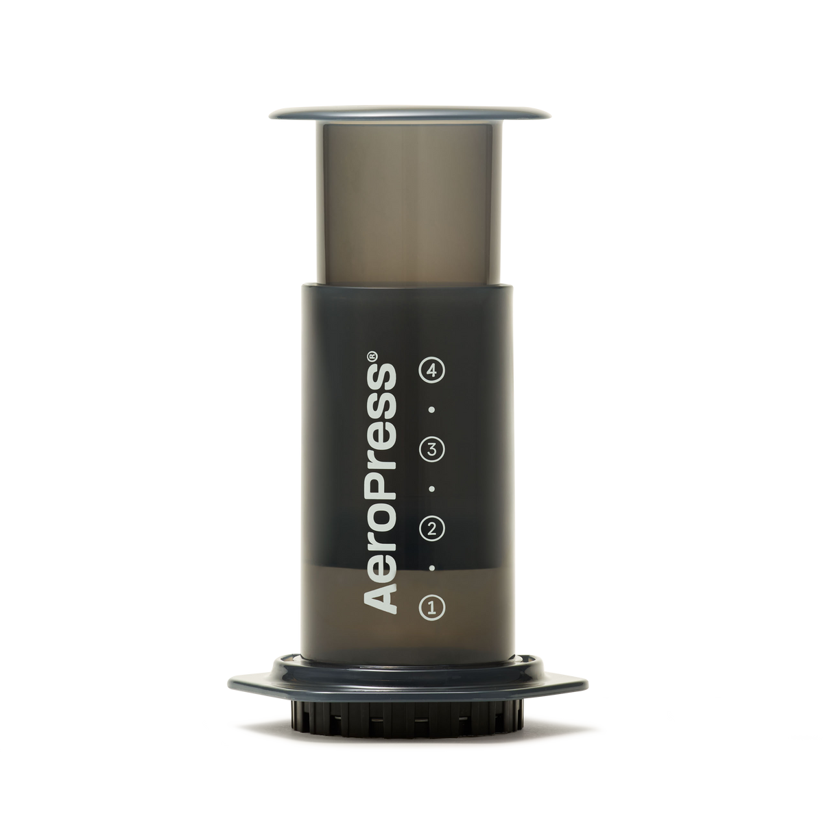 The AeroPress Coffee Maker, shown upright on a white background with visible measurement markings and its distinct logo, is ready to brew a smooth, low-acidity cup of coffee using a compostable paper filter.