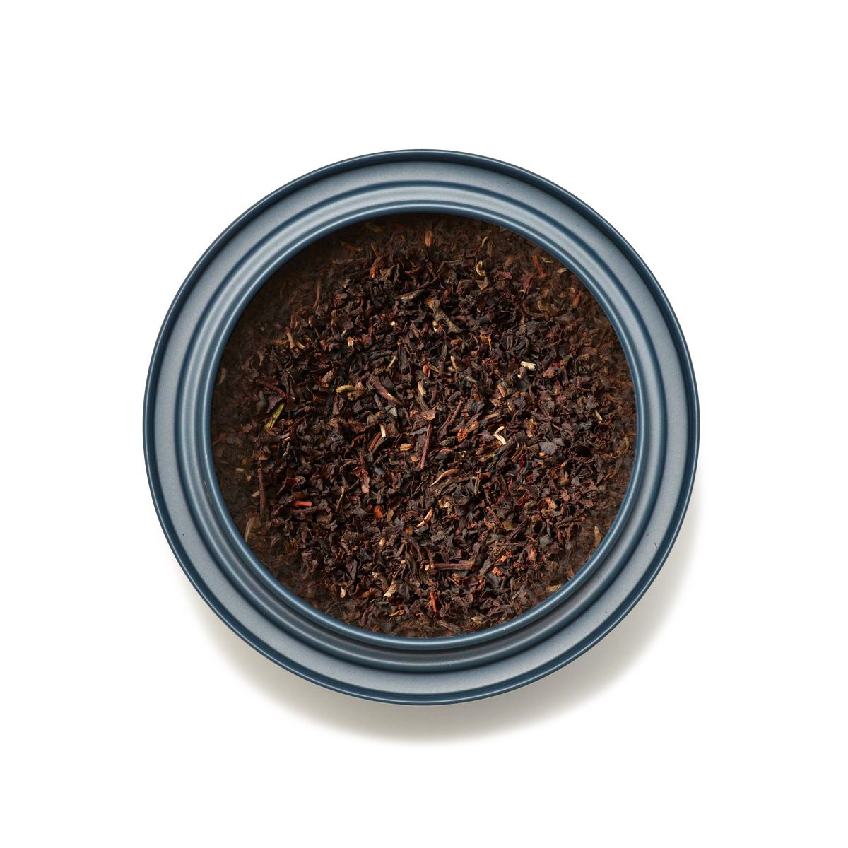A round, blue-rimmed container filled with loose English Breakfast Loose Leaf Tea, viewed from above on a white background.