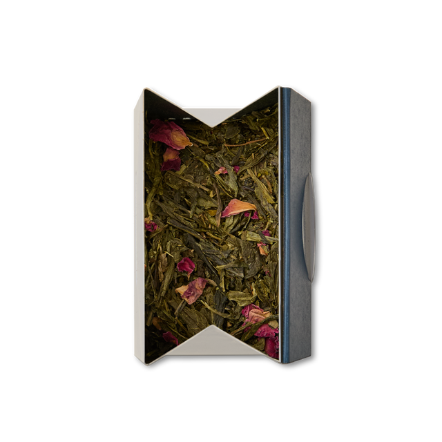 A top view of a box containing Cherry Blossom Loose Leaf Tea, with sencha green tea mixed with dried rose petals, set against a plain white background.