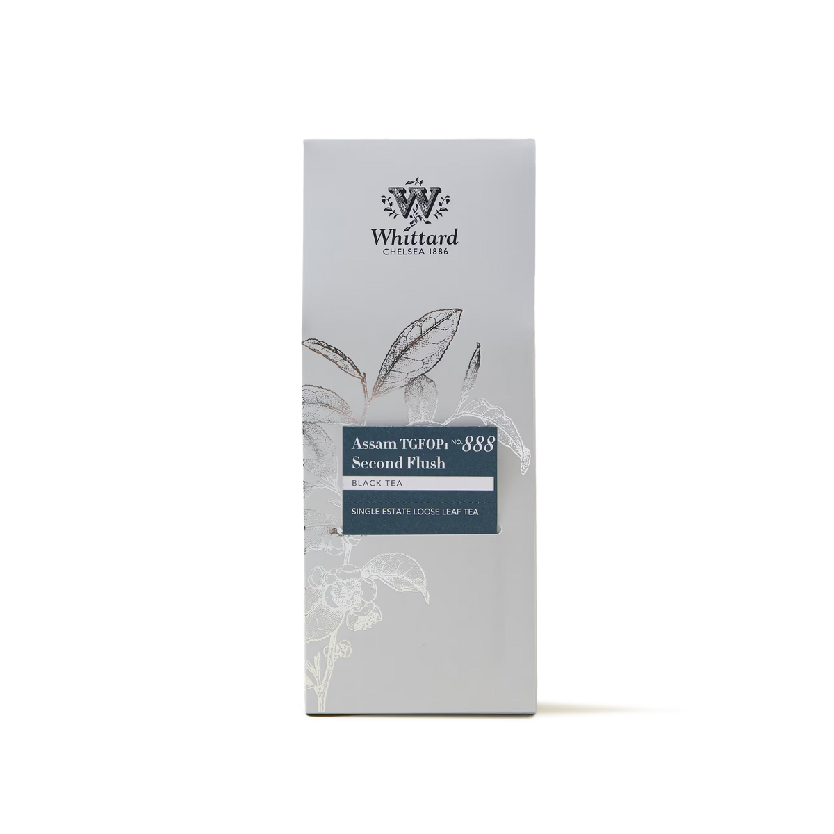 A box of Assam TGFOP1 Loose Leaf Tea, a premium black tea showcasing a floral illustration and the brand logo on a light gray background.