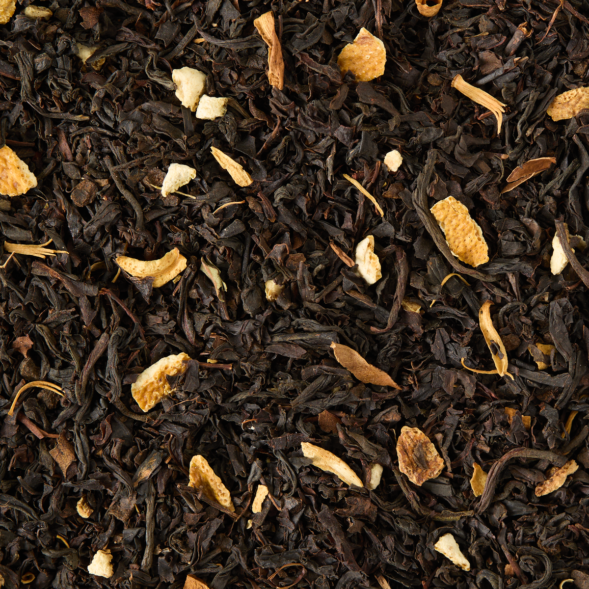 Orange Blossom Loose Leaf Tea features black tea blended with small pieces of dried orange peel, orange blossom, and other natural ingredients for a textured and colorful blend.