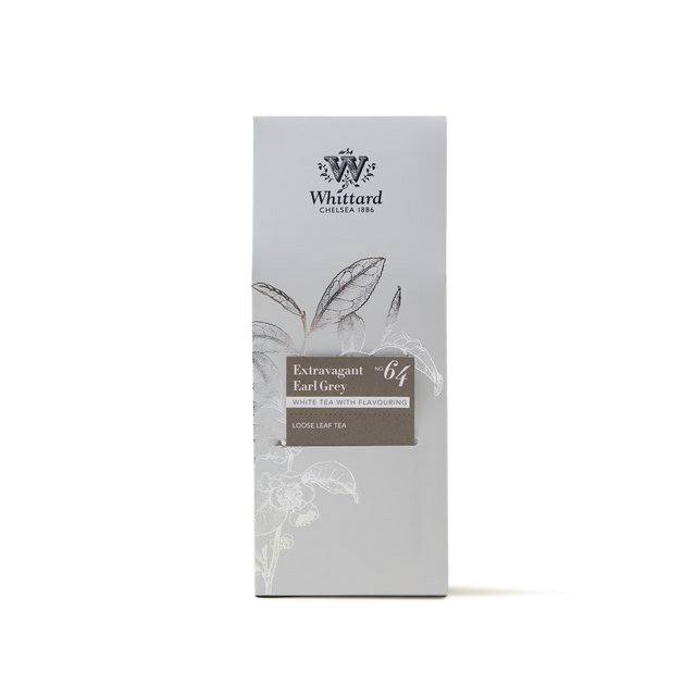 A box of Extravagant Earl Grey Loose Leaf Tea, featuring a delicate blend of white Earl Grey tea and Madagascan vanilla. The light grey packaging is adorned with a subtle tea leaf illustration and white floral accents, highlighting this exquisite loose leaf tea.