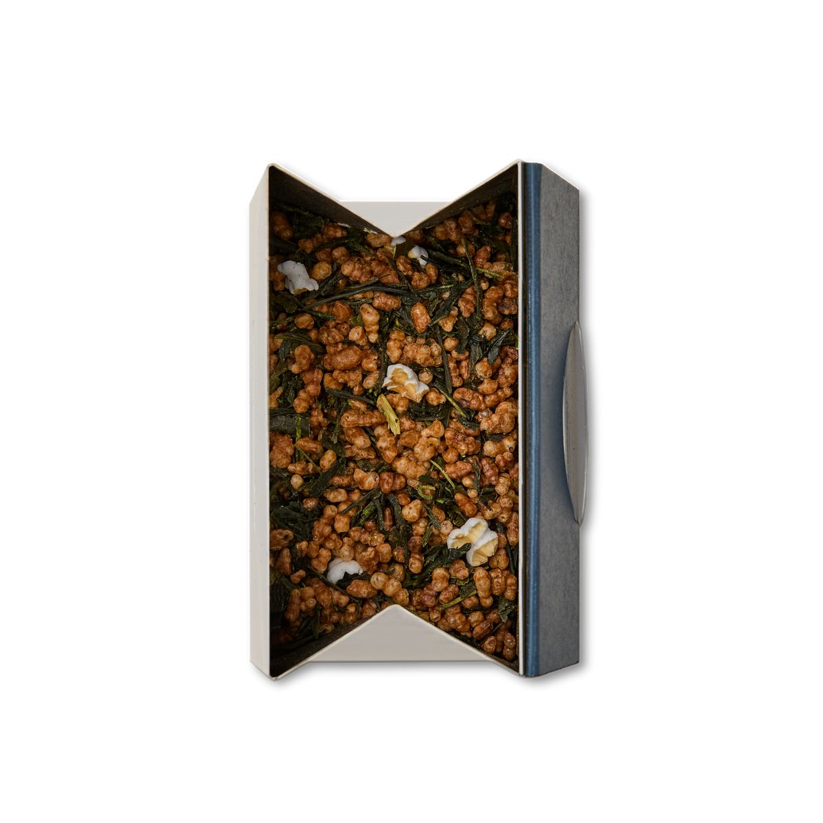 A box of Genmaicha Loose Leaf Tea, featuring visible roasted brown rice and green tea leaves with a few popped rice pieces on top, photographed from above against a white background.
