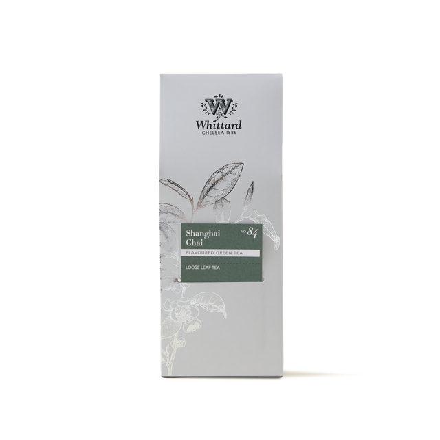A box of Shanghai Chai Loose Leaf Tea, featuring botanical illustrations and minimalist packaging in grey and green tones.