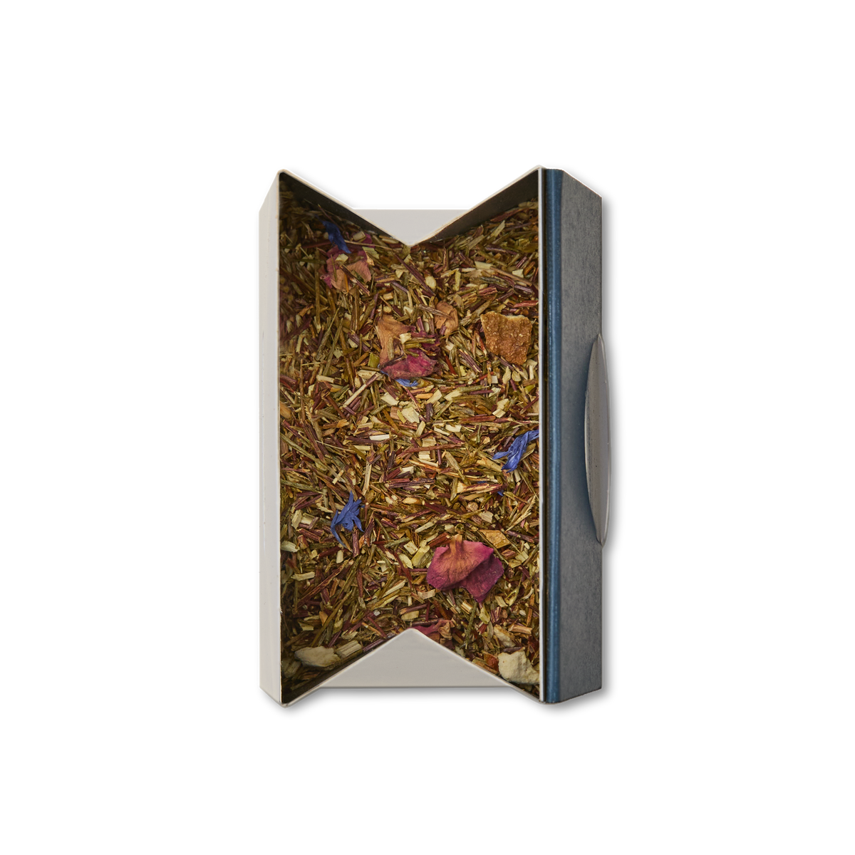 An open box of Rainforest Rooibos Loose Leaf Tea displays reddish-brown leaves and vibrant flower petals nestled inside, viewed from above on a white background. This visually striking herbal blend showcases tropical rooibos—a naturally caffeine-free tea—celebrated for its refreshing flavors and the aromatic allure of exotic botanicals.