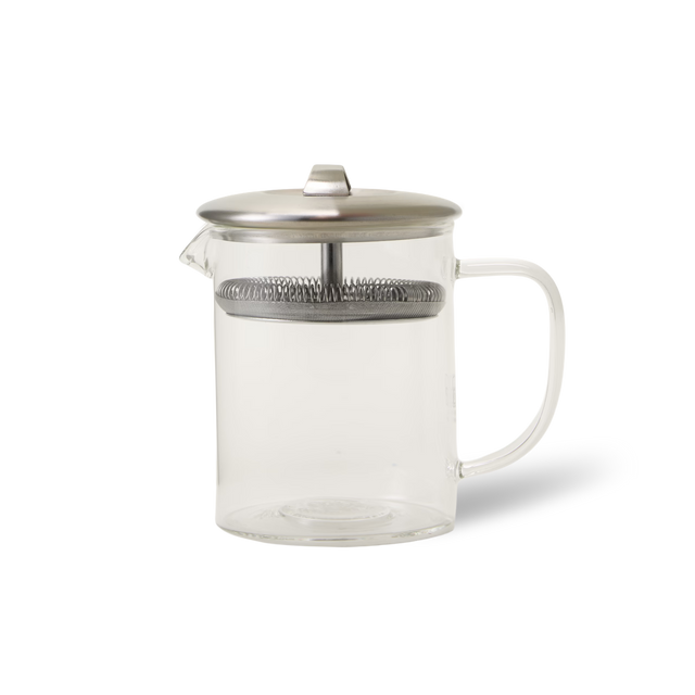A clear glass French press with a metal lid, plunger, and handle, shown on a white background.