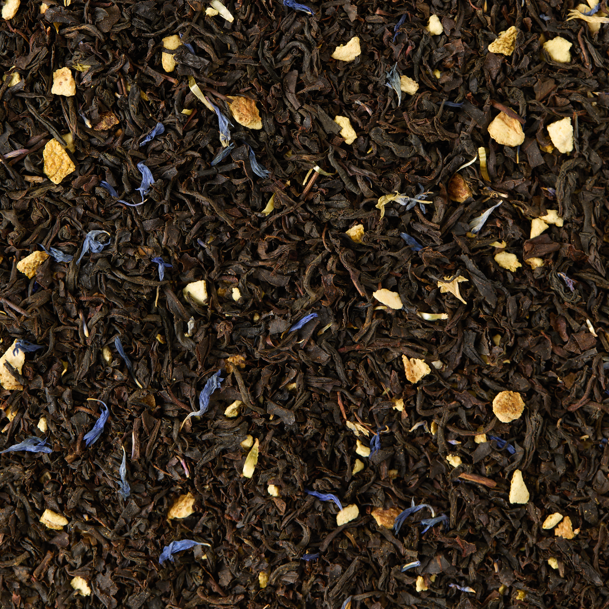 Earl Grey Loose Leaf Tea features a vibrant blend of black tea leaves, dried orange peel pieces, and scattered blue cornflower petals, delivering a textured and colorful mix with a bright citrus aroma of bergamot for a classic Earl Grey experience.