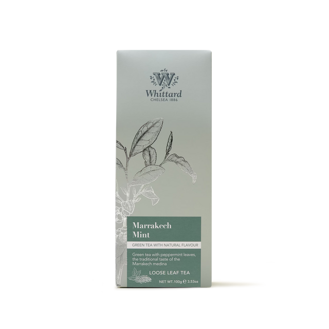 A package of Marrakech Mint Loose Leaf Tea, adorned with botanical illustrations and text highlighting its blend of gunpowder green tea and peppermint. The green box features subtle floral graphics, evoking the tradition of Moroccan mint tea.