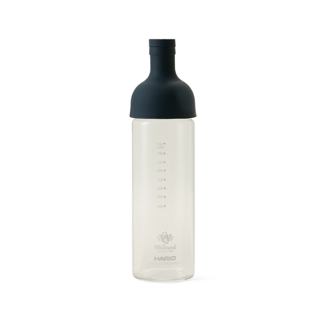 Blue Hario Cold Brew Tea Bottle with a black silicone top, featuring clear measurement markings from 200ml to 750ml in 100ml increments. Designed for Japanese cold brew preparation, this bottle is perfect for making refreshing cold brew tea. The Whittard and Hario logos are printed on the lower front, providing a sleek and stylish finish.