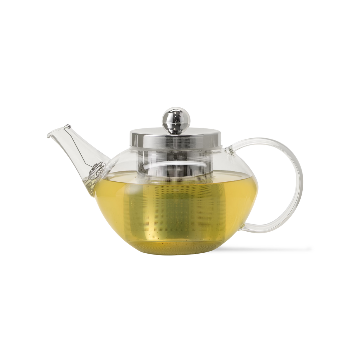 A clear glass teapot with a metal lid and infuser, filled with yellow-green tea, sits on a plain white background.