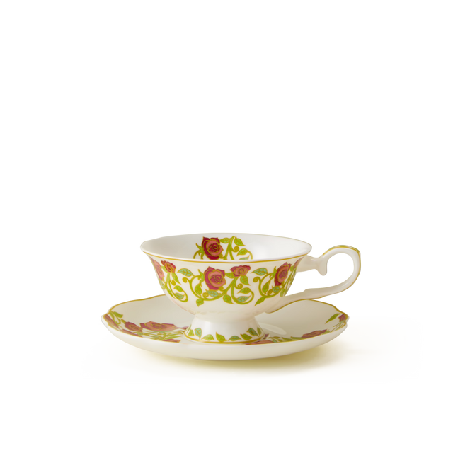 The English Rose Tea Cup and Saucer, crafted from fine bone china and adorned with a gold rim along with a pattern of red roses and green leaves, embodies the classic charm of an English tea setting. Set against a plain white background, this teacup’s timeless beauty is beautifully showcased.