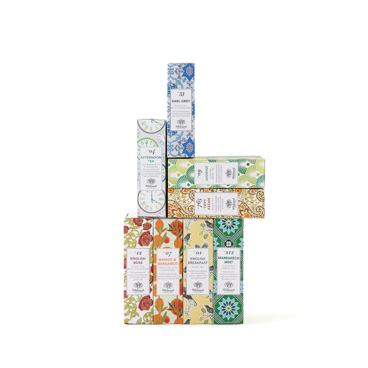 A stack of colorful, vintage-style boxes from The Tea Discovery Collection, featuring floral and geometric patterns and labeled with celebrated teas and traditional teabags, arranged against a white background.