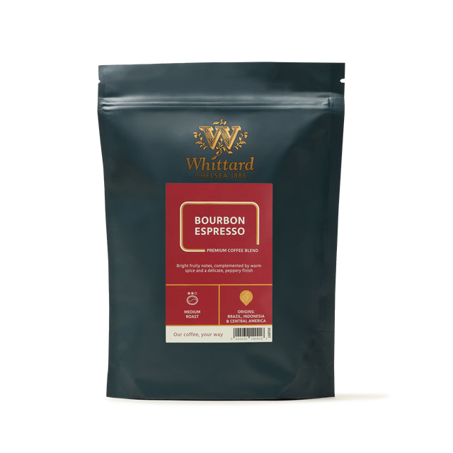 A dark green bag of Bourbon Espresso Coffee features a red label, gold logo, and text describing it as a medium roast coffee with spicy and cedary notes. This premium whole bean coffee offers a distinctive blend for those who appreciate refined flavor and aroma.