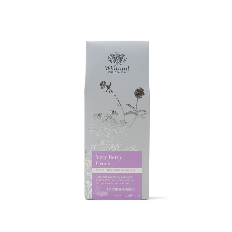 A silver Whittard Very Berry Crush loose fruit infusion tea package with botanical illustrations and a purple label, standing upright against a plain white background.