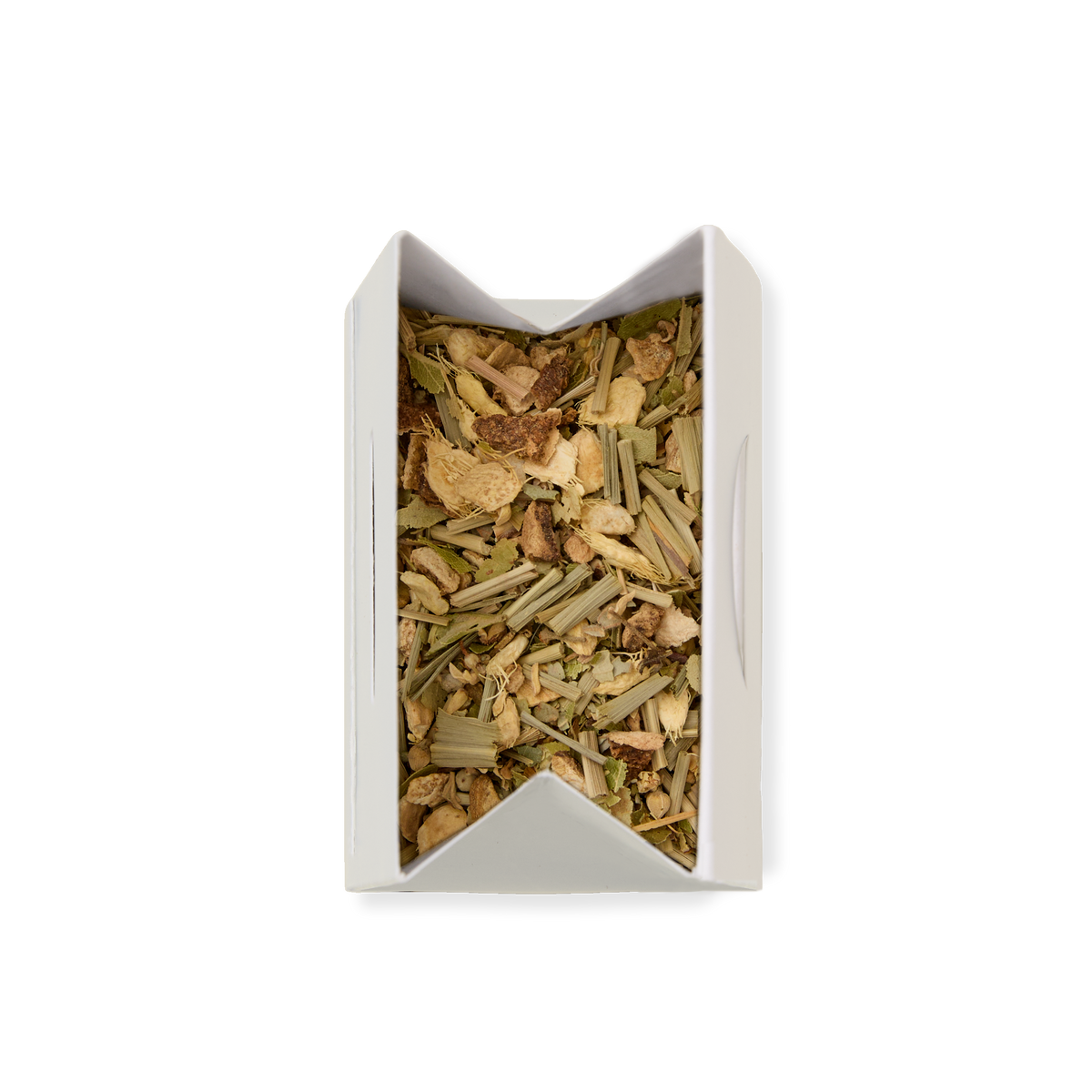 A top-down view of a white rectangular box filled with Lemon & Ginger Loose Infusion, showcasing a blend of green and brown dried herbs and plant pieces, set against a plain white background.