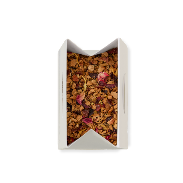 A white rectangular box with open flaps containing Sleepy Loose Infusion—a blend of dried fruit and flower pieces—viewed from above on a white background.