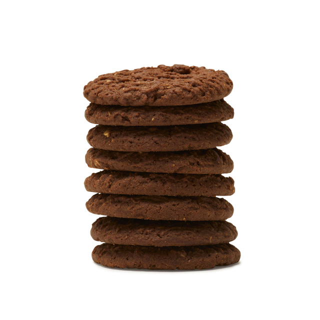 A stack of eight round Triple Chocolate Biscuits, crafted with rich dark chocolate, is arranged neatly against a plain white background.