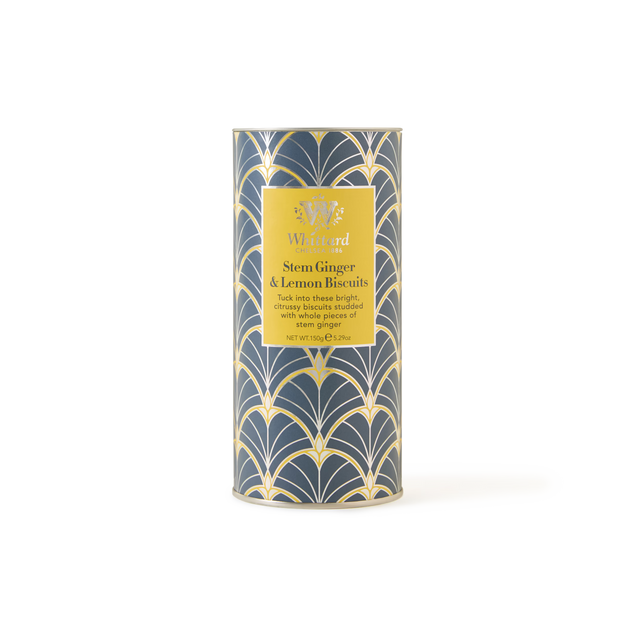 A cylindrical tin of Stem Ginger & Lemon Biscuits, adorned with a striking blue and gold art deco pattern and a yellow front label, is perfect for anyone who loves ginger or lemon biscuits.
