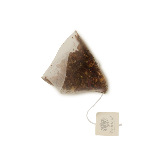 A single pyramid-shaped Cold Brew Passionfruit, Mango & Peach Infusion Teabag sits on a white background. A string connects the teabag to a square paper tag labeled Whittard.