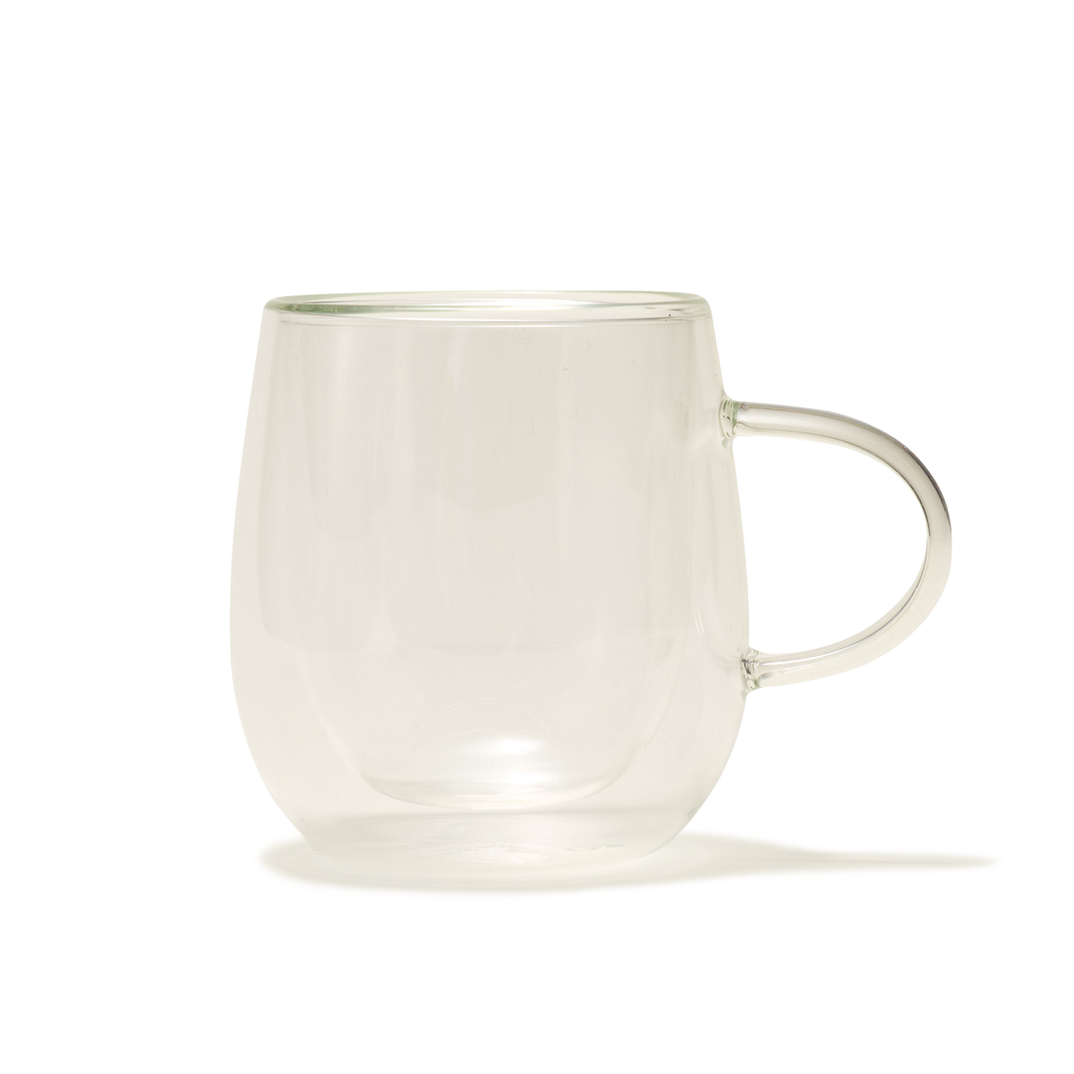 The Nova Double-Walled Mug, made of clear borosilicate glass with a handle, is displayed against a plain white background.