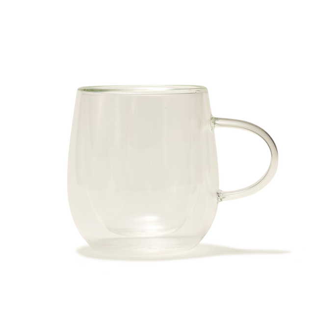 The Nova Double-Walled Mug, made of clear borosilicate glass with a handle, is displayed against a plain white background.