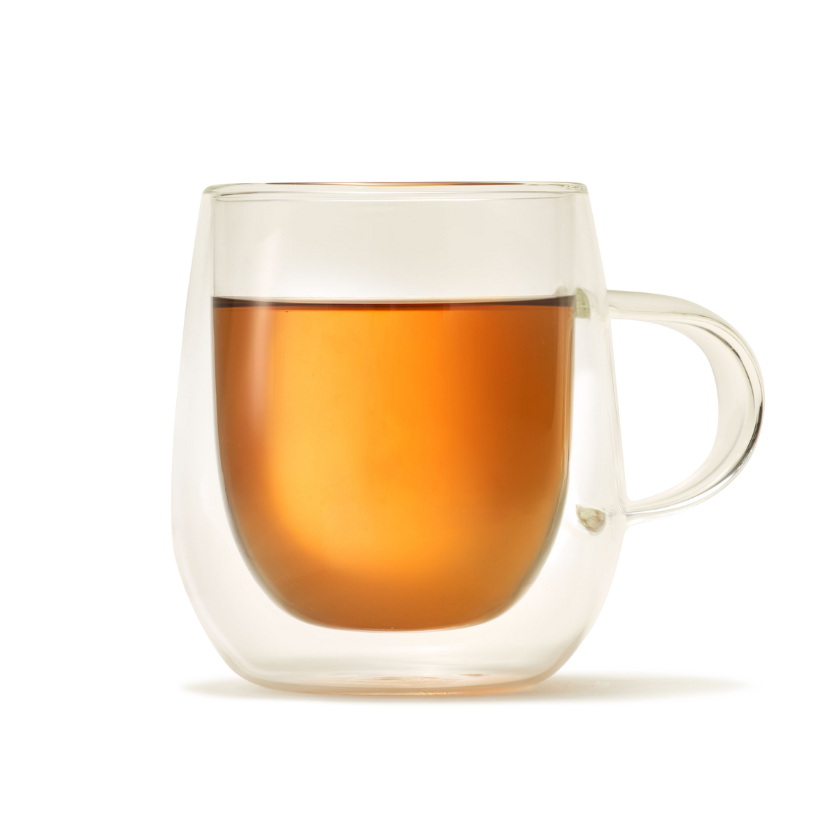 A Nova Double-Walled Mug made of clear borosilicate glass, filled with amber-colored tea and set against a plain white background.