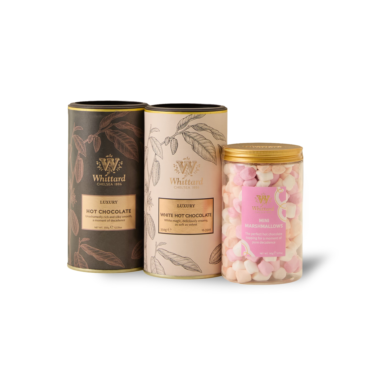 Three Whittard containers from The Luxury Hot Chocolate Gift Box—one black tin for luxury hot chocolate, one cream tin for white hot chocolate, and a clear jar filled with pink and white mini marshmallows—are arranged side by side on a white background, creating the perfect hot chocolate gift.