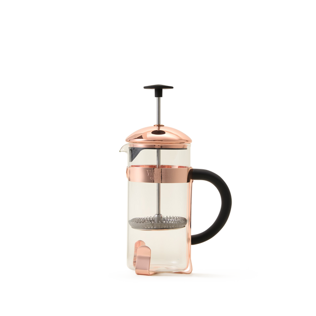 The Whittard Copper 3-Cup Cafetière is an elegant French press coffee maker, crafted from durable borosilicate glass and highlighted by a copper-colored lid and frame. Featuring a sleek black handle and a stainless steel filter plunger, this stylish cafetière stands out beautifully against a plain white background, making it both functional and visually appealing.