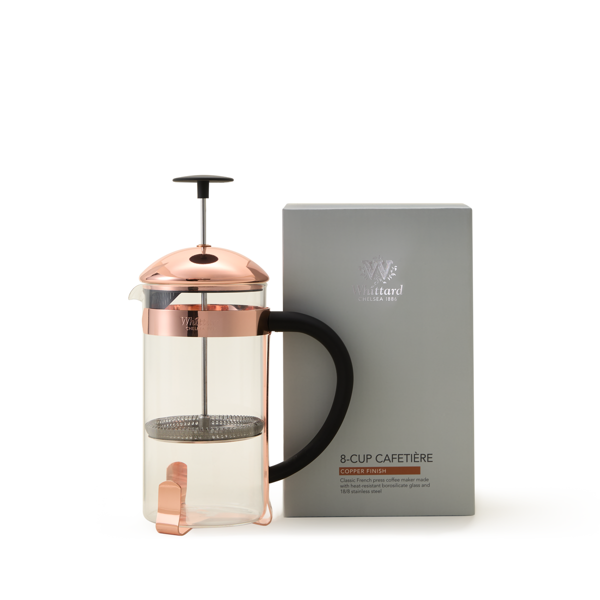 A glass French press made from durable borosilicate glass with a copper lid and handle sits next to a gray box labeled Whittard Copper 8-Cup Cafetière.