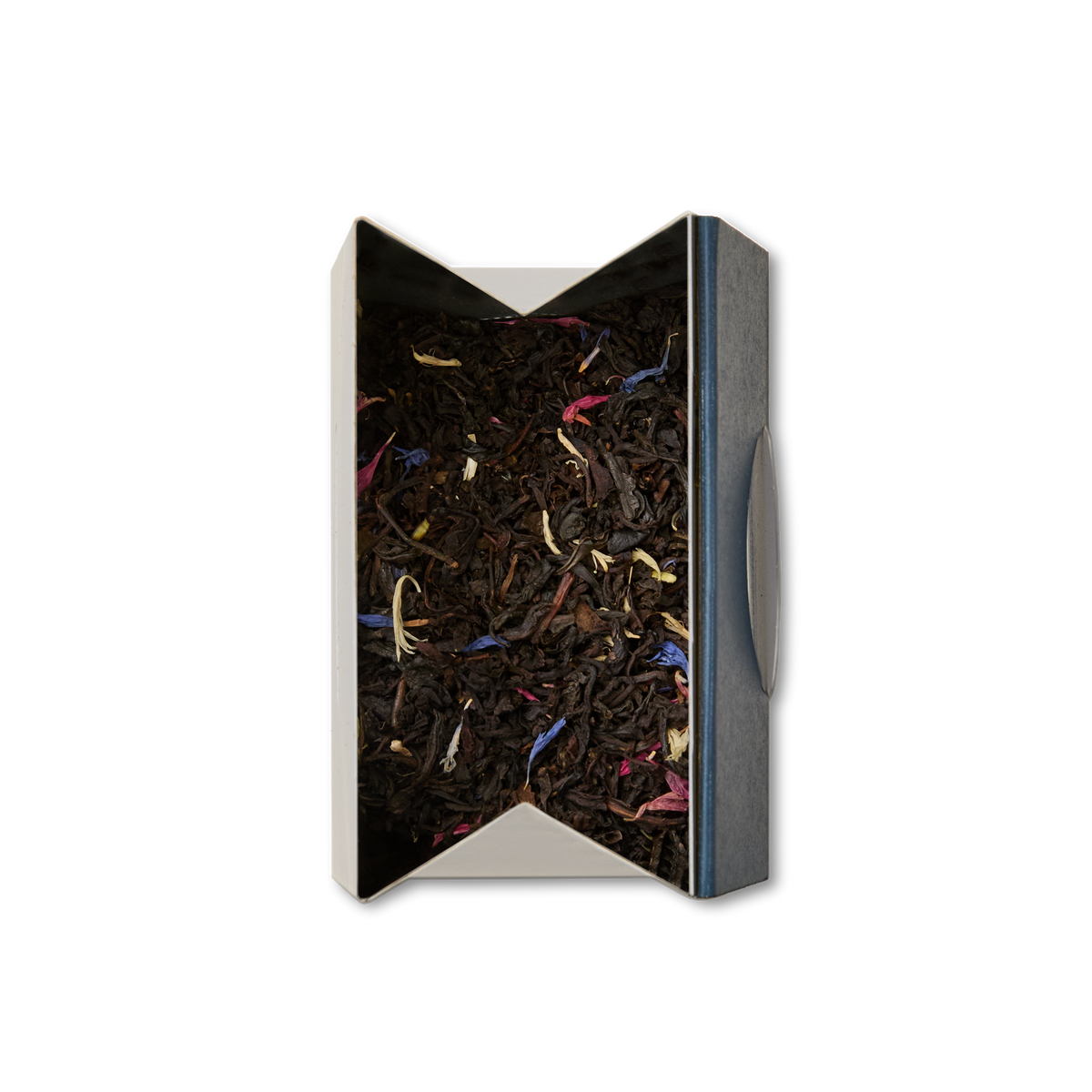 A top view of an opened box containing Regal Blend Loose Leaf Tea, showcasing black tea mixed with colorful flower petals—pink, yellow, and blue—against a white background. This blend nods to British tea traditions and features a delicate infusion of Madagascan vanilla for a fragrant twist.