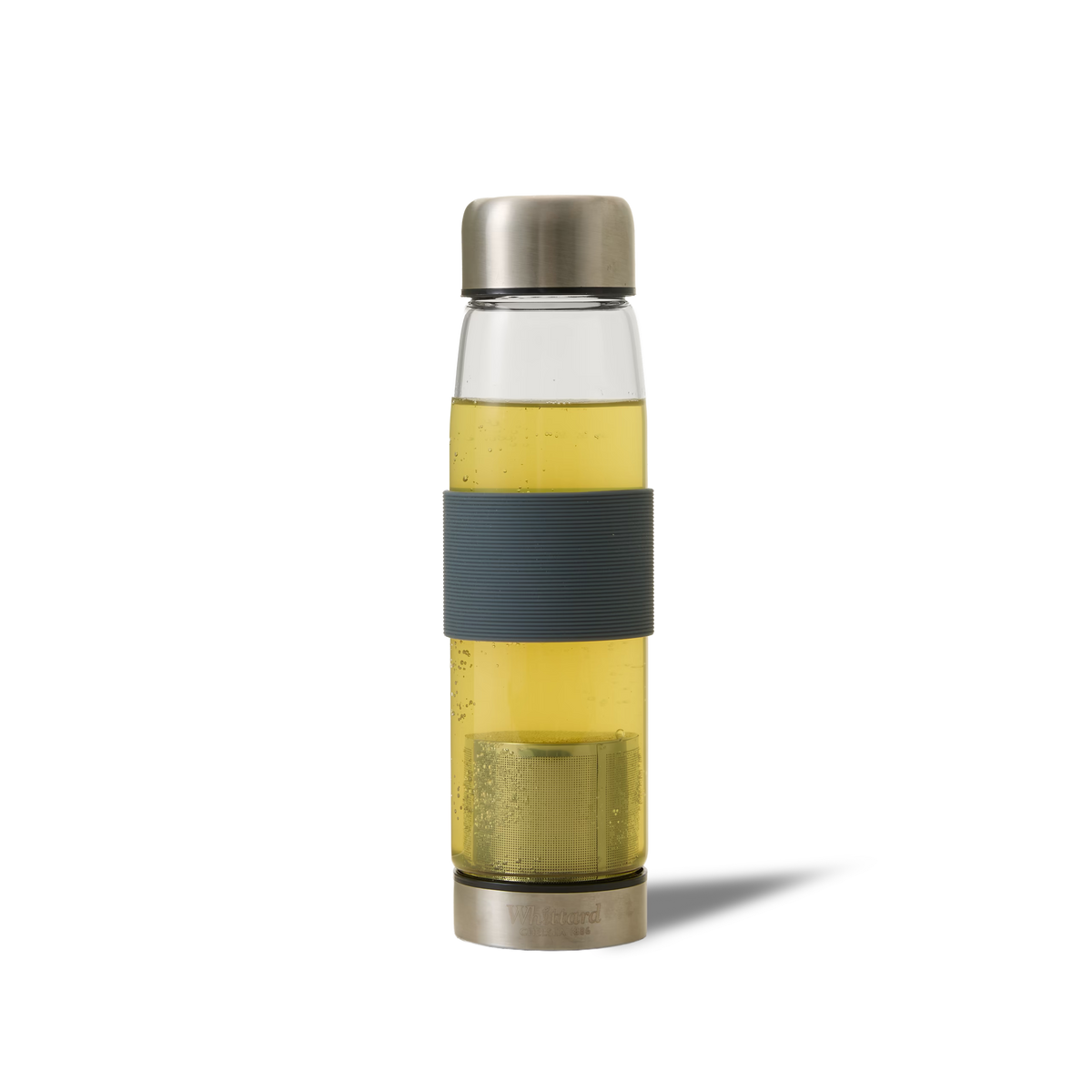 A glass water bottle with a silver metal lid and base, filled with a yellow liquid. The bottle has a dark, textured grip around the middle and a removable compartment at the bottom.