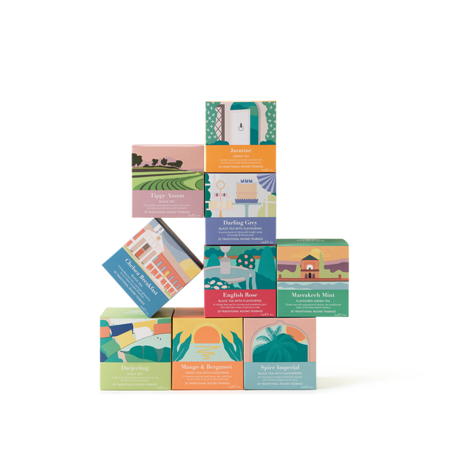 Nine colorful tea boxes are stacked in a playful arrangement on a white background. Each box features unique illustrations and bold text with different tea flavors such as Jasmine, English Rose, and Darjeeling.