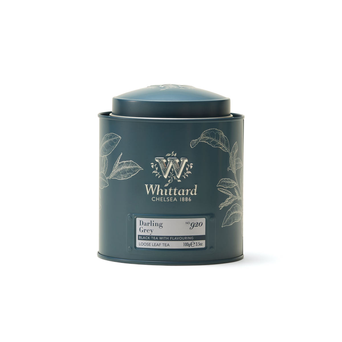 A blue Whittard of Chelsea tin with a botanical design, labeled Darling Grey Loose Leaf Tea. The tin is cylindrical with a round lid and displays product details on the front.