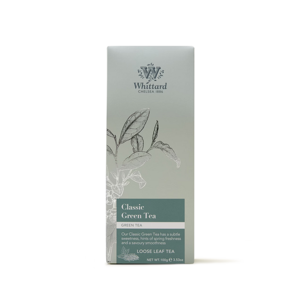 A box of Classic Green Tea loose leaf tea, presented in packaging with botanical illustrations and a green-gray gradient. This Sencha style green tea offers a subtle sweetness and a hint of springtime freshness.