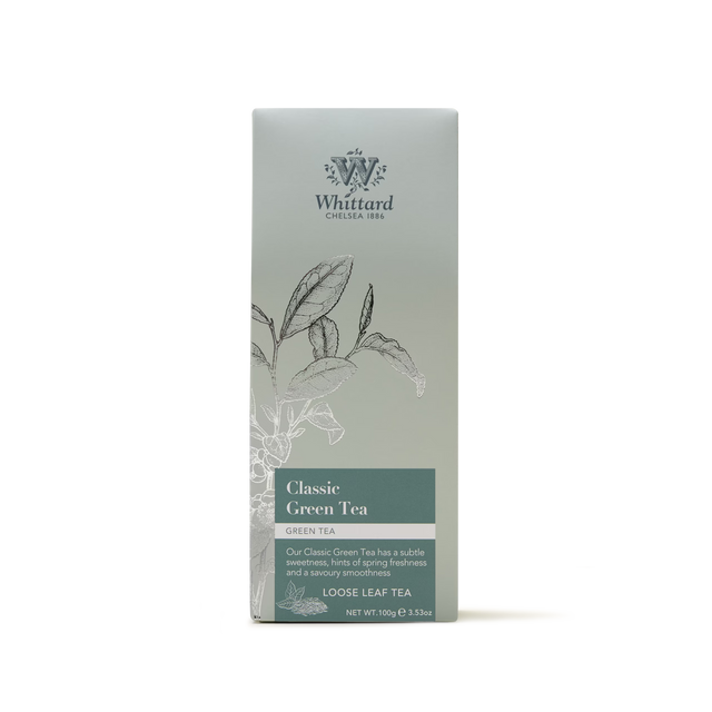 A box of Classic Green Tea loose leaf tea, presented in packaging with botanical illustrations and a green-gray gradient. This Sencha style green tea offers a subtle sweetness and a hint of springtime freshness.