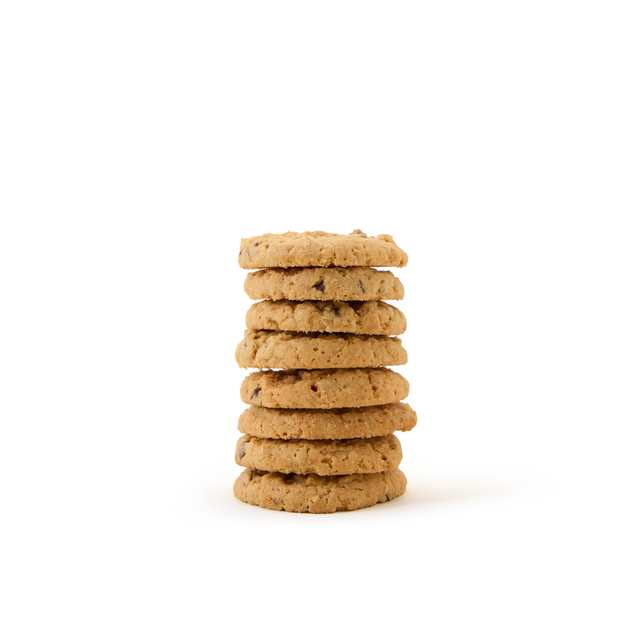 A stack of six chocolate chip cookies on a plain white background.