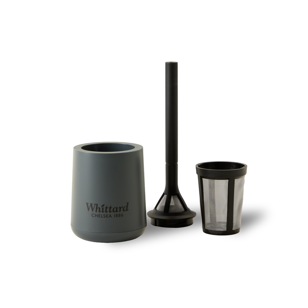 A grey Whittard Chelsea 1886 mug, a black plunger, and a mesh tea infuser, all placed on a plain white background.