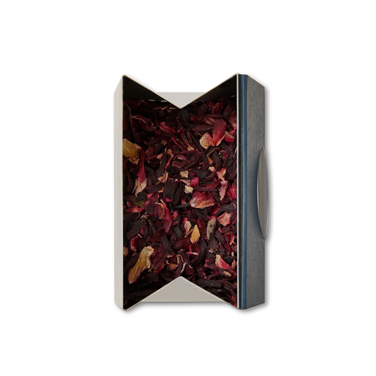 A rectangular open box of Pure Hibiscus Loose Infusion, filled with mostly dark red dried petals and a few yellow pieces, viewed from above on a white background.