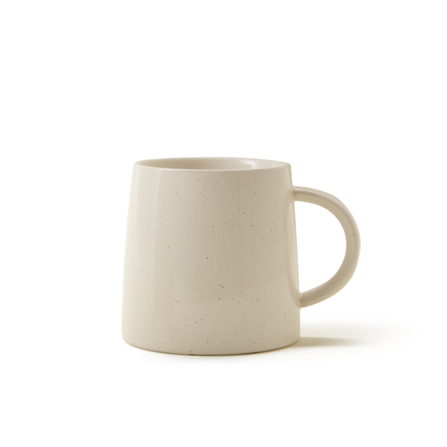The Arran Mug, featuring a cream-colored stoneware finish with subtle speckles and a rounded handle, is shown against a white background.
