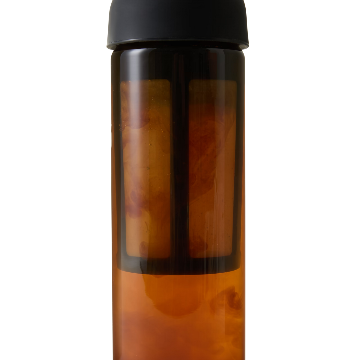 A tall, cylindrical glass bottle with a black lid contains amber liquid and a visible infuser or filter inside.