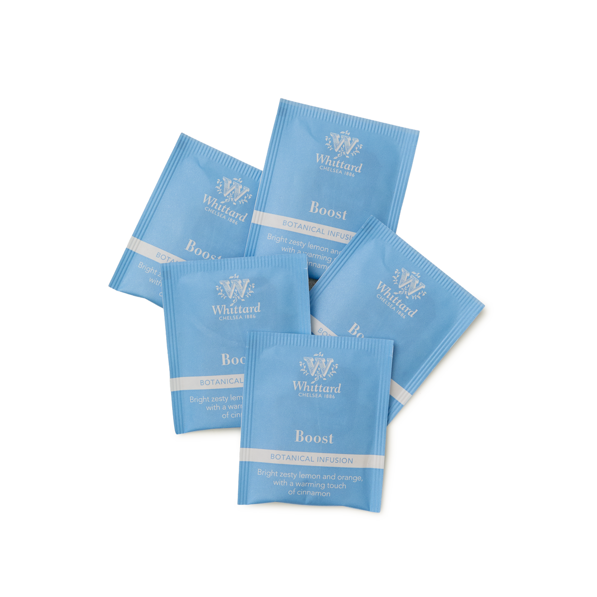 Five blue Whittard Boost Botanical Infusion tea sachets are arranged in a fan pattern on a white background. The sachets include details about the flavor: lemon and orange with comforting ginger.