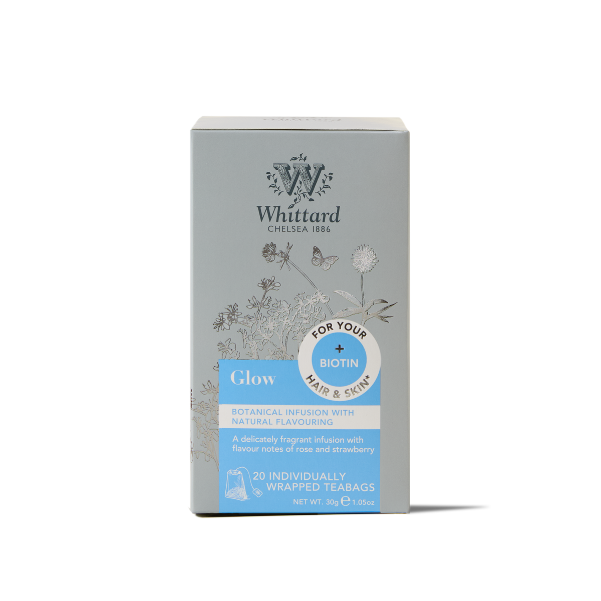 Glow Botanical Wellness Infusion Teabags come in a gray box adorned with floral illustrations and blue accents. Each box contains 20 individually wrapped teabags, featuring a strawberry flavor and biotin to support hair and skin health.