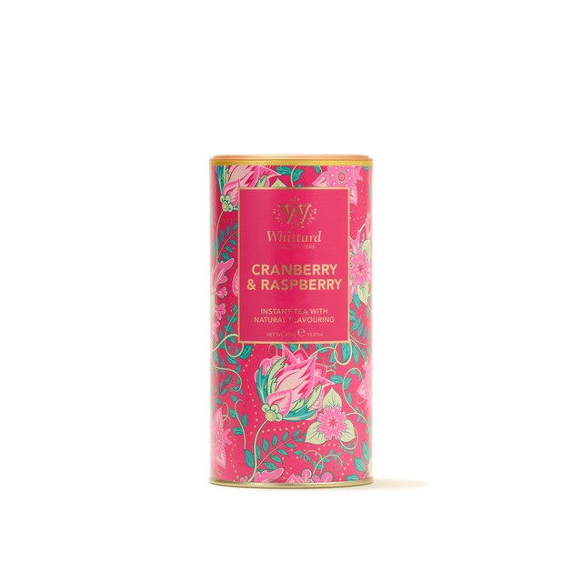 A cylindrical tin of Cranberry & Raspberry Flavour Instant Tea, featuring a natural fruit flavoring, is adorned with a bright pink floral design and topped with a gold lid—ideal for anyone craving a refreshing beverage. This instant tea offers a delicious cranberry and raspberry fruit flavour to brighten any moment.