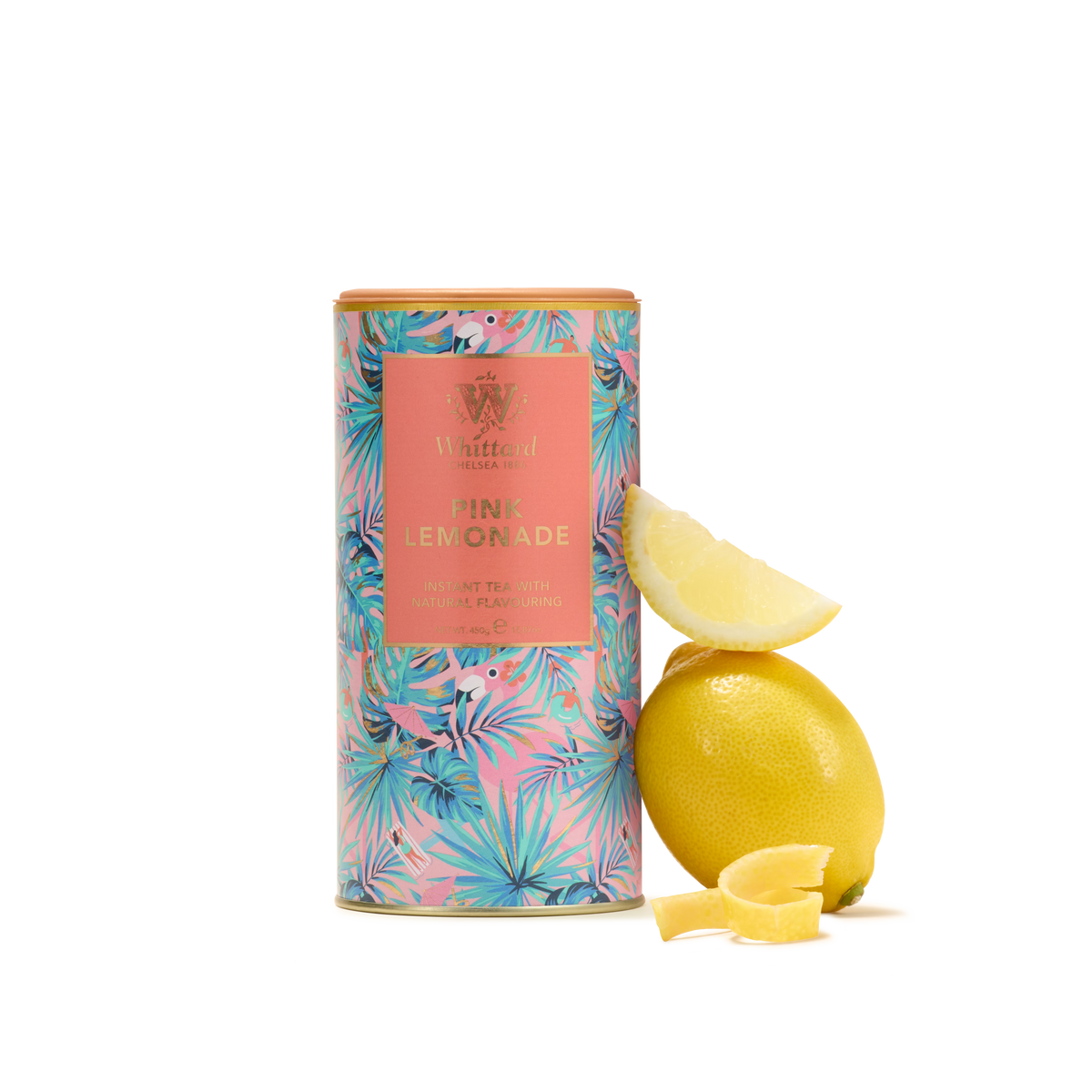 A vibrant tin labeled “Pink Lemonade Flavour Instant Tea” sits beside a whole lemon, a lemon wedge, and two small pieces of lemon on a plain white background—perfectly capturing the essence of this refreshing beverage and classic summer drink.