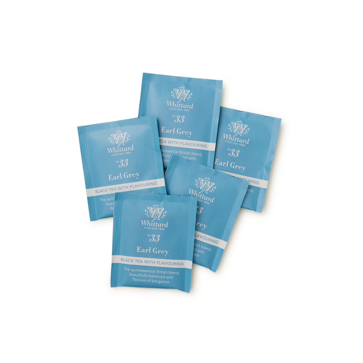Five blue packets of Tea Discoveries Earl Grey Teabags are arranged in a scattered pattern on a white background. The front of each packet is labeled with the product name and tea type in white text, highlighting the distinctive blend of Ceylon black tea with aromatic bergamot.
