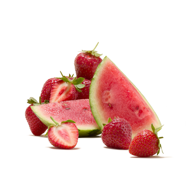 Slices of watermelon and several whole and halved strawberries are arranged together on a white background, perfectly evoking the refreshing flavour found in Strawberry and Watermelon Flavour Instant Tea.