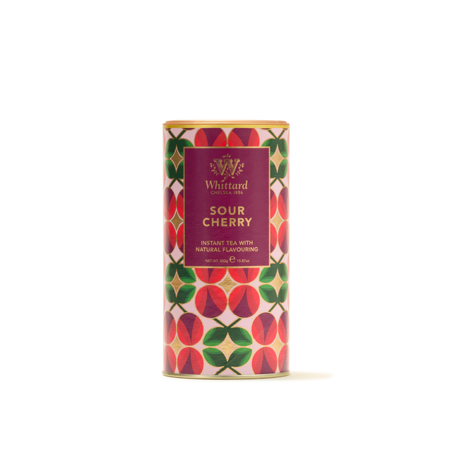 A vibrant cylindrical tin of Sour Cherry Instant Tea featuring a cherry and green leaf pattern with a purple label on the front—ideal for those who love fruity drinks such as Morello cherry instant tea.