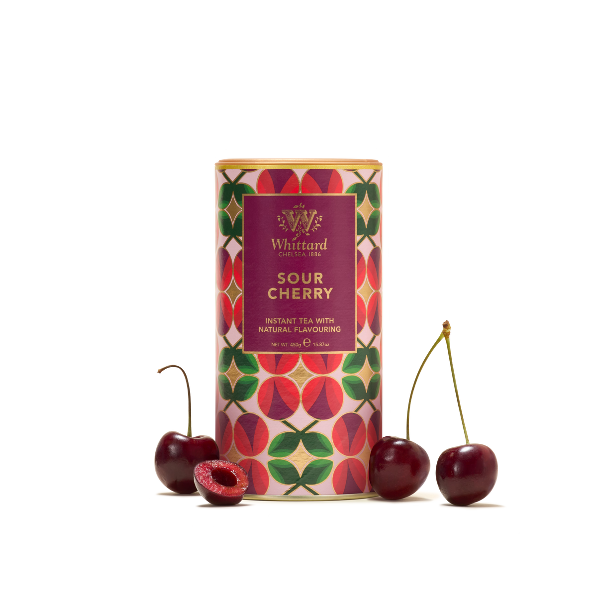 A colorful tin labeled Sour Cherry Instant Tea stands upright, surrounded by three cherries, one of which is halved to reveal the inside. The plain white background highlights this vibrant addition to fruit drinks for instant tea lovers.