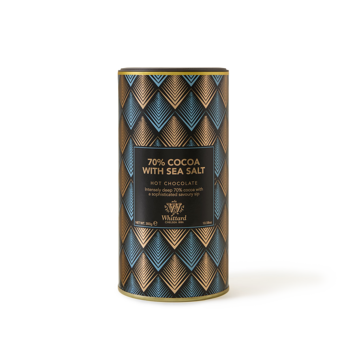 A cylindrical tin of Whittard hot chocolate, labeled 70% Cocoa with Sea Salt, features a blue and gold geometric pattern on the packaging.