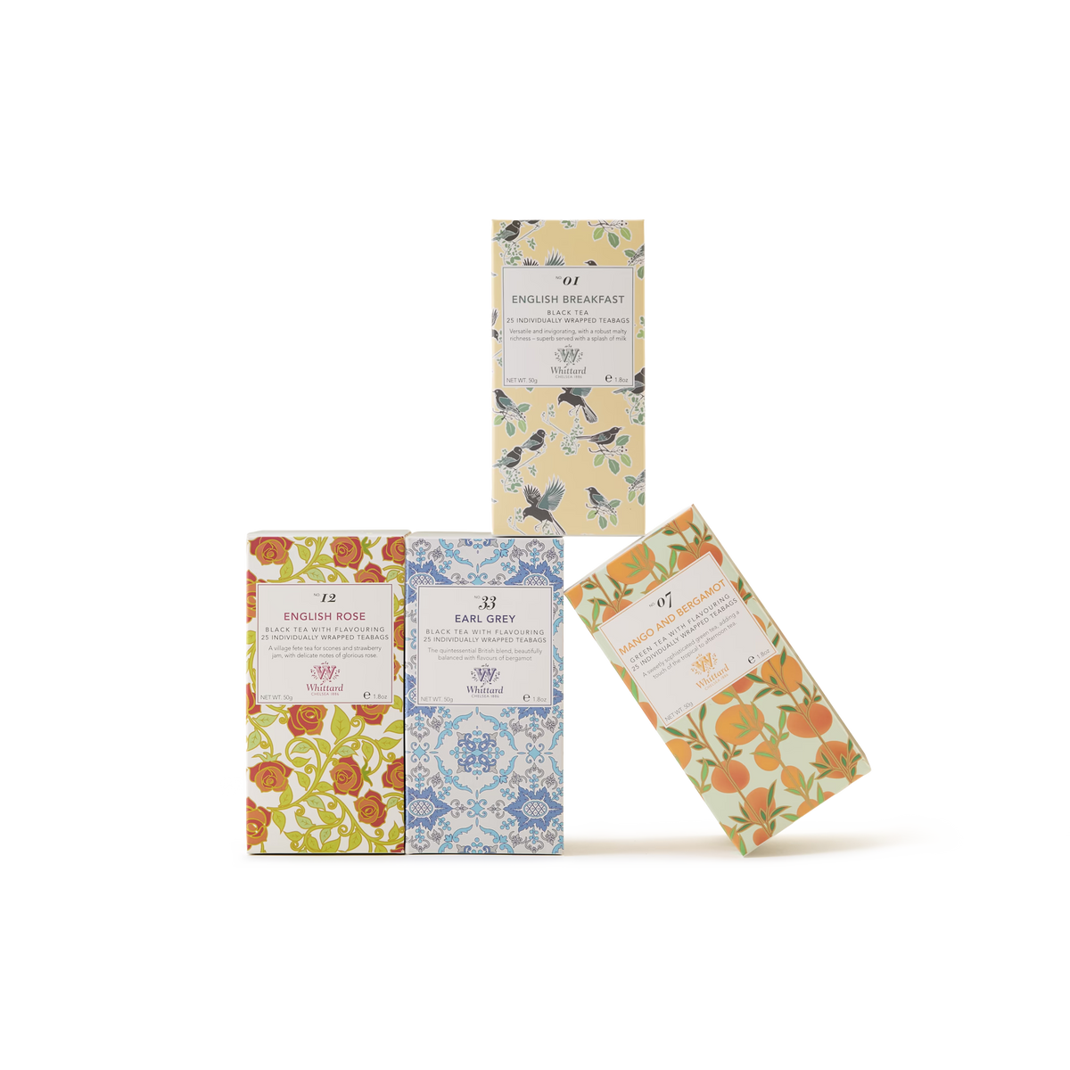 Four boxes of tea with decorative floral patterns in different colors are arranged on a white background; three boxes stand upright, and one leans against the group. Each box features a white label with text.